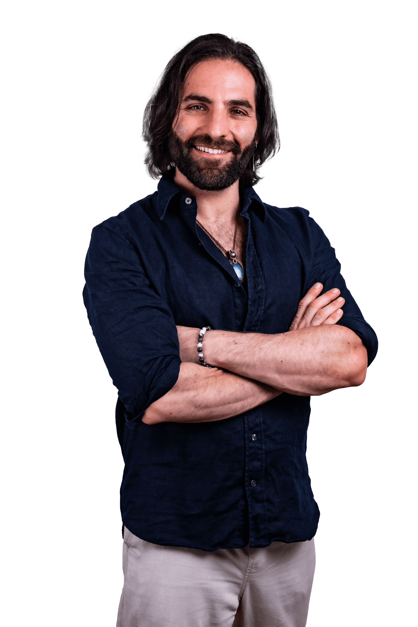 Joseph Buchoff in a navy linen shirt, arms crossed, smiling warmly